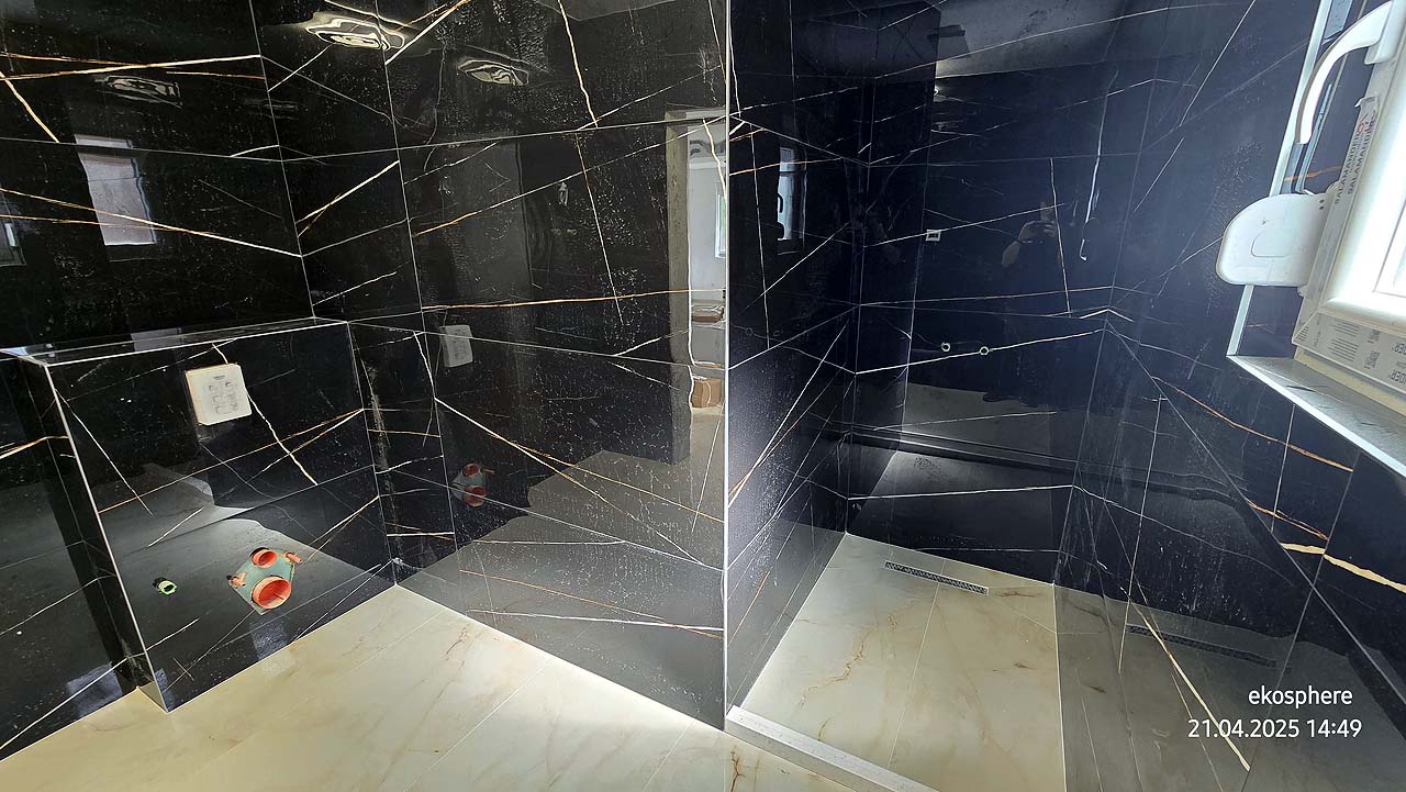 Luxury bathroom in Ulcinj: black marble walls, bright marble floors, walk-in shower, sunny window. Exclusive at montenegro-listings.me by Ekosphere doo.