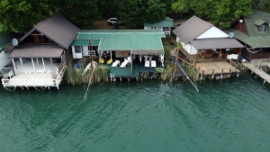 Aerial of eco-friendly lakeside cabins for sale in Ulcinj, top Montenegro investment; exclusive via montenegro-listings.me by ekosphere doo.