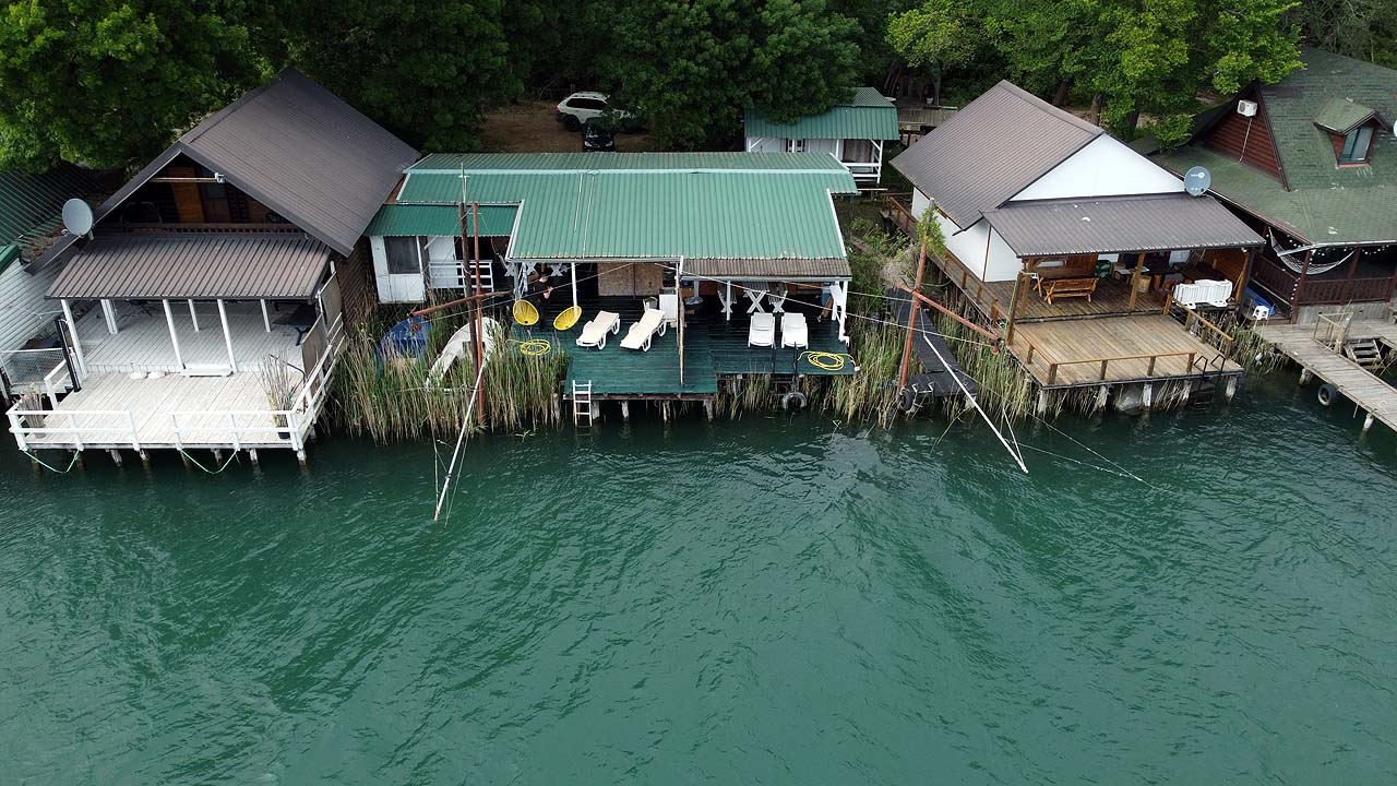 Aerial of eco-friendly lakeside cabins for sale in Ulcinj, top Montenegro investment; exclusive via montenegro-listings.me by ekosphere doo.