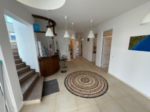 Elegant bright hallway in Ulcinj, Montenegro with mosaic tiles, stylish staircase—prime real estate by Ekosphere on montenegro-listings.me.