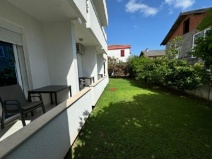 Prime Ulcinj real estate: green lawn, white building with patio, stunning views. Exclusive listing by montenegro-listings.me (Ekosphere doo).