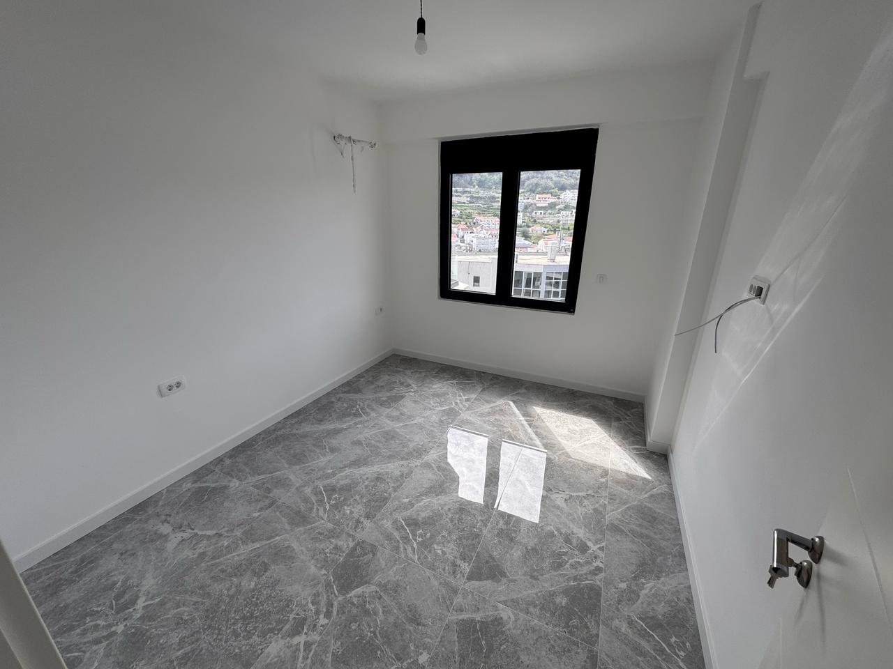 Spacious unfurnished room with city view in Ulcinj; top real estate investment on montenegro-listings.me by Ekosphere doo.