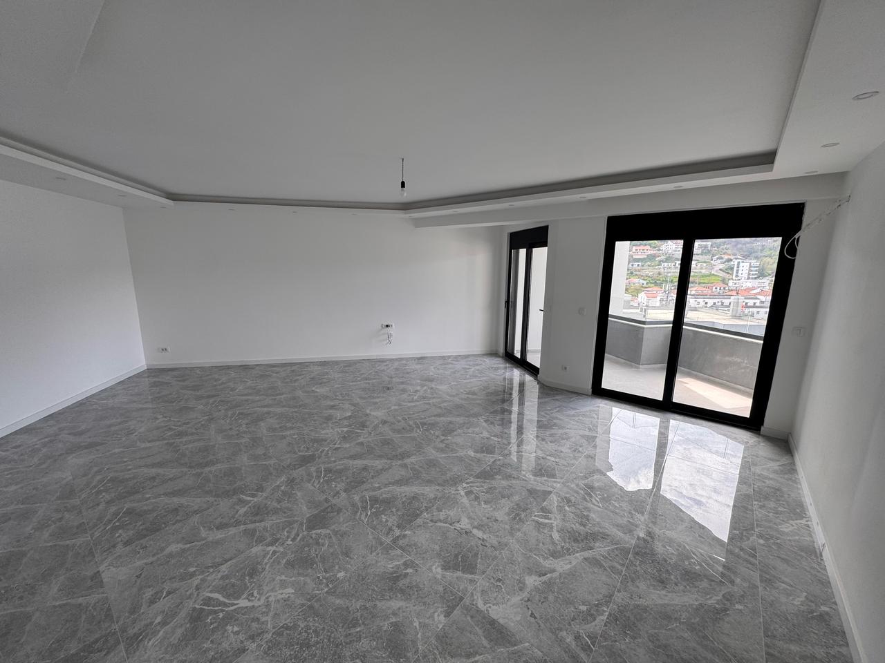 Modern unfurnished room in Ulcinj, Montenegro with marble floors, balcony city view&mdash;prime investment on montenegro-listings.me by ekosphere doo.