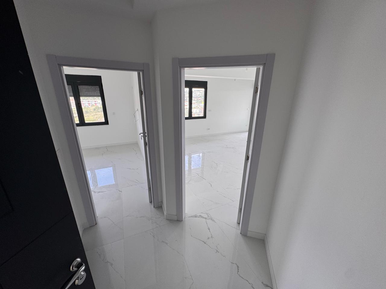 Spacious Ulcinj property: sunlit rooms, modern white interiors, glossy tile floors&mdash;exclusive at montenegro-listings.me by Ekosphere.