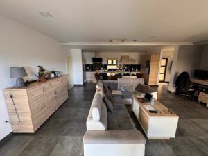 Modern open-concept living and kitchen, stylish furnishings, large tile floor. Prime Ulcinj eco-property by Ekosphere on montenegro-listings.me.
