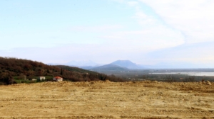 Prime cleared land in Ulcinj, Montenegro with scenic mountain views—ideal for investment. Listed on montenegro-listings.me by Ekosphere doo.