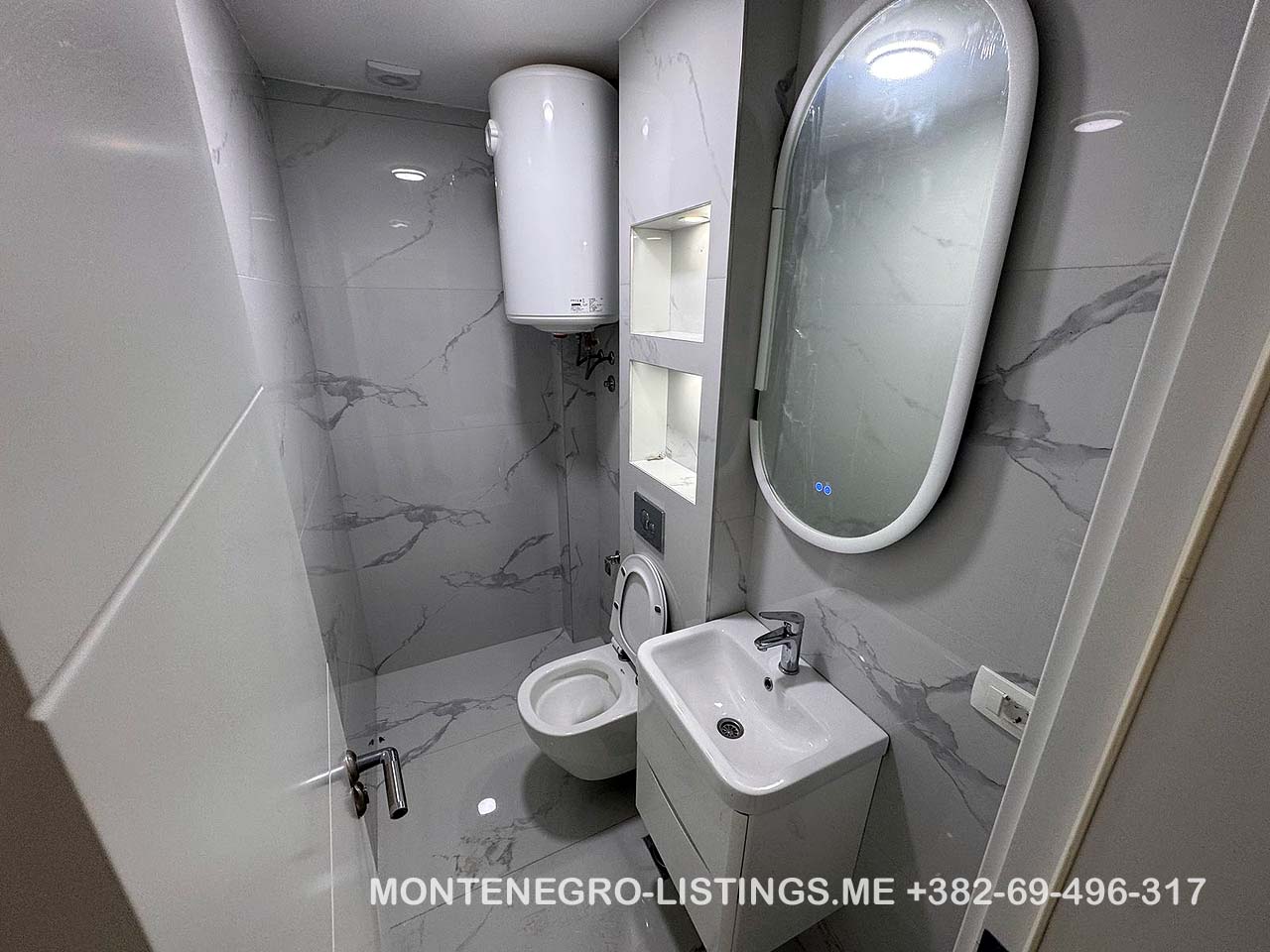 Modern bathroom with sink and toilet, ideal for Ulcinj property investment. On montenegro-listings.me by ekosphere doo.