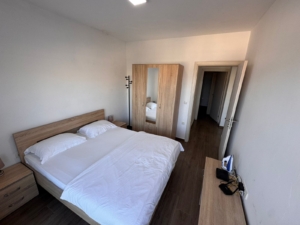 Modern Ulcinj property for sale: bright bedroom with double bed, wardrobe, and more. Listed on montenegro-listings.me by ekosphere doo.
