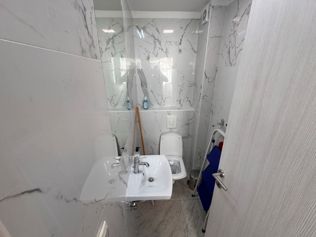 Stylish Ulcinj bathroom with marble walls, modern fixtures—ideal Montenegro investment. Exclusive on montenegro-listings.me by ekosphere doo.