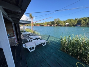 Luxury wooden deck with lounge chairs, river views, and prime Ulcinj real estate. Invest in Montenegro-listings.me by ekosphere doo.