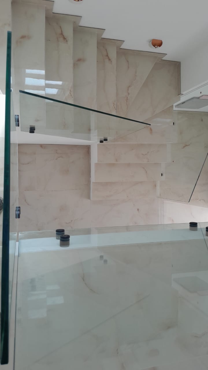 Stunning marble staircase with glass railings, bright natural light&mdash;luxury Ulcinj real estate. Exclusive on montenegro-listings.me by ekosphere doo.
