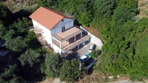Exclusive Ulcinj villa: two-story white home with red roof, large terraces, private parking in lush greenery—only on montenegro-listings.me by Ekosphere doo.