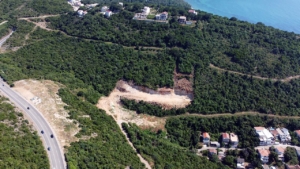 Prime cleared land in Ulcinj, Montenegro with lush greenery, sea views, road access—ideal for investment. Listed on montenegro-listings.me by ekosphere doo.