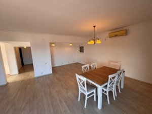 Modern, spacious Ulcinj property with light wood floors, dining area, and open layout—exclusive on montenegro-listings.me by Ekosphere.