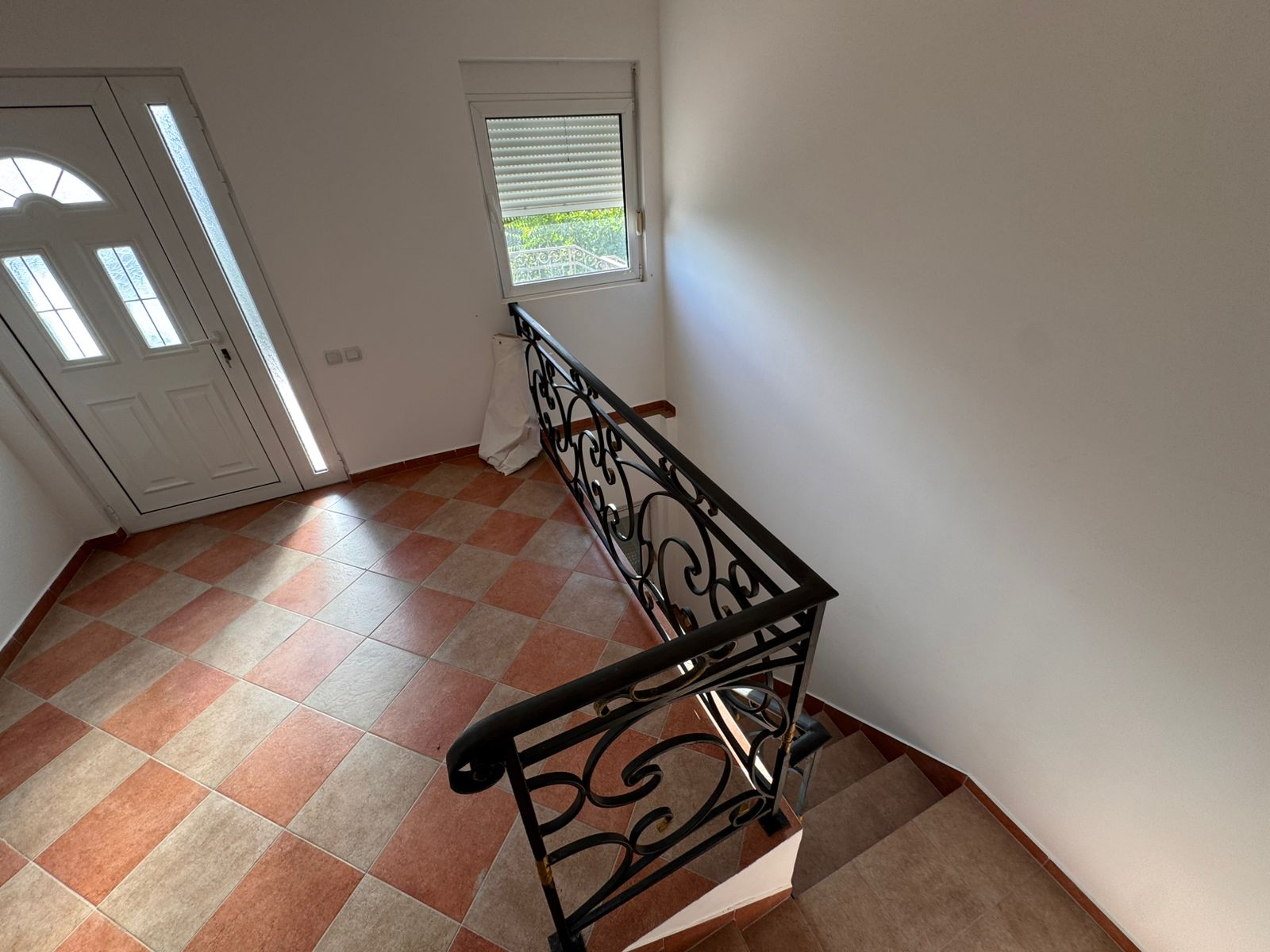 Stylish tiled hallway in Ulcinj Montenegro real estate, elegant staircase, modern entry&mdash;exclusive listing by montenegro-listings.me, a project of ekosphere doo.