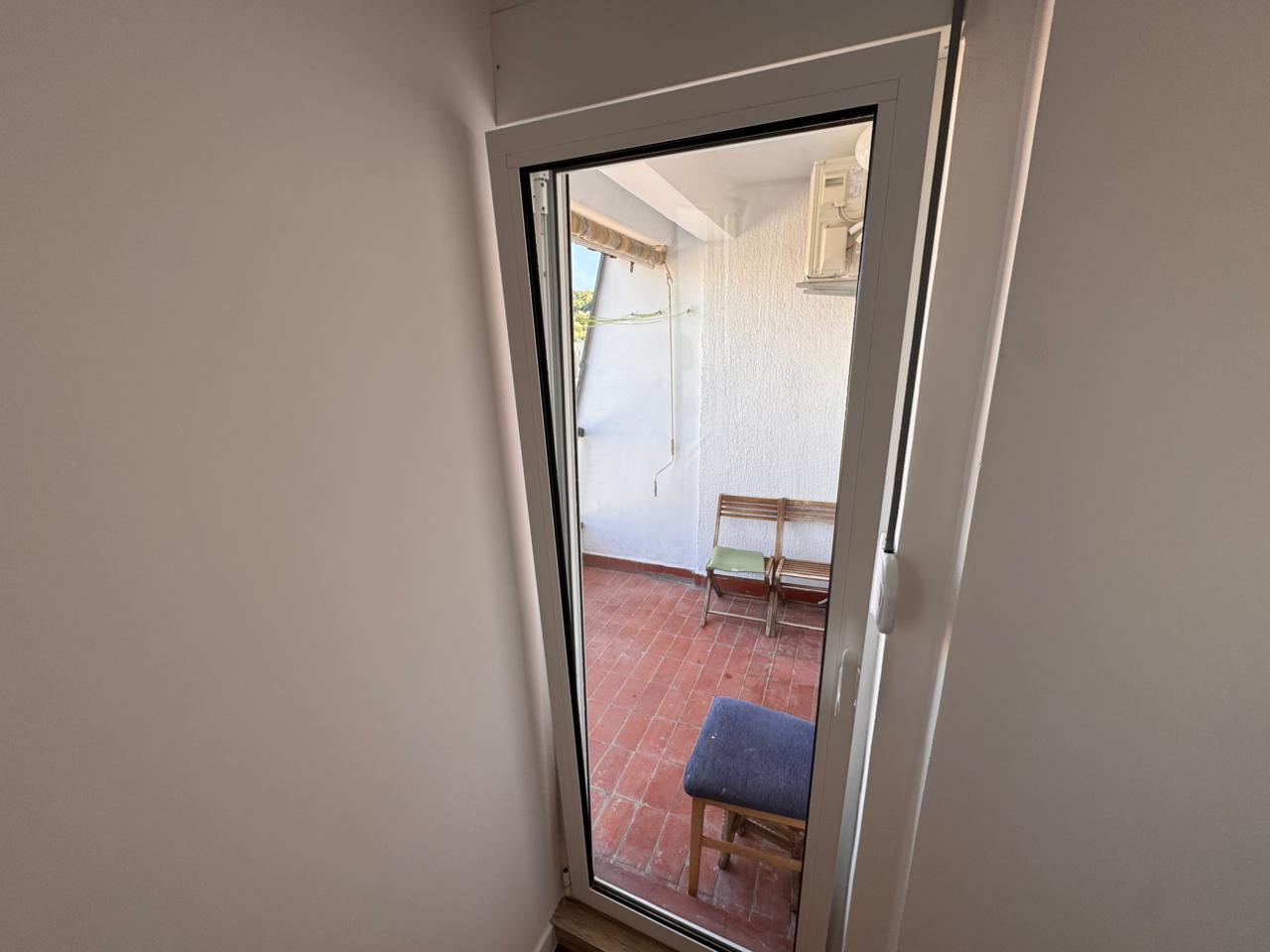 Charming Ulcinj patio with glass door, red tiles, wooden bench—prime Montenegro investment by montenegro-listings.me & ekosphere doo.