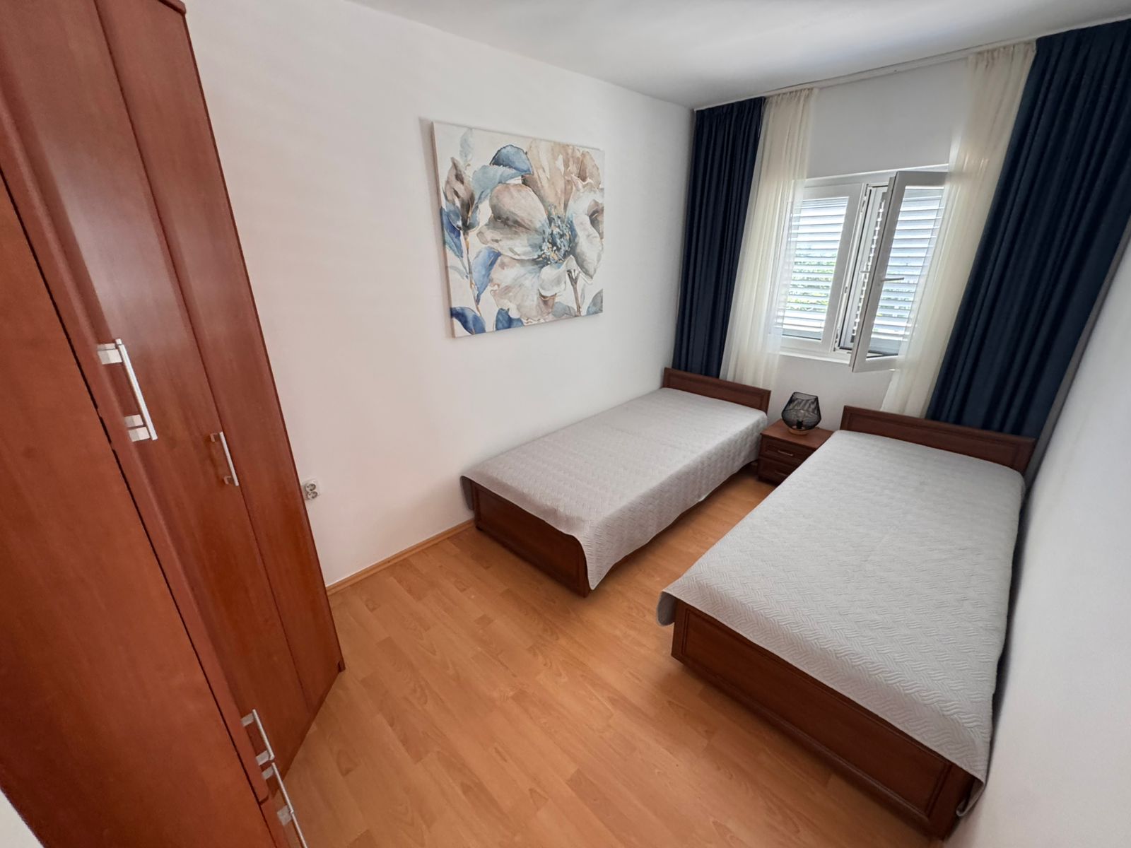 Charming Ulcinj bedroom with twin beds, stylish decor and ample storage&mdash;ideal Montenegro investment from ekosphere doo at montenegro-listings.me.