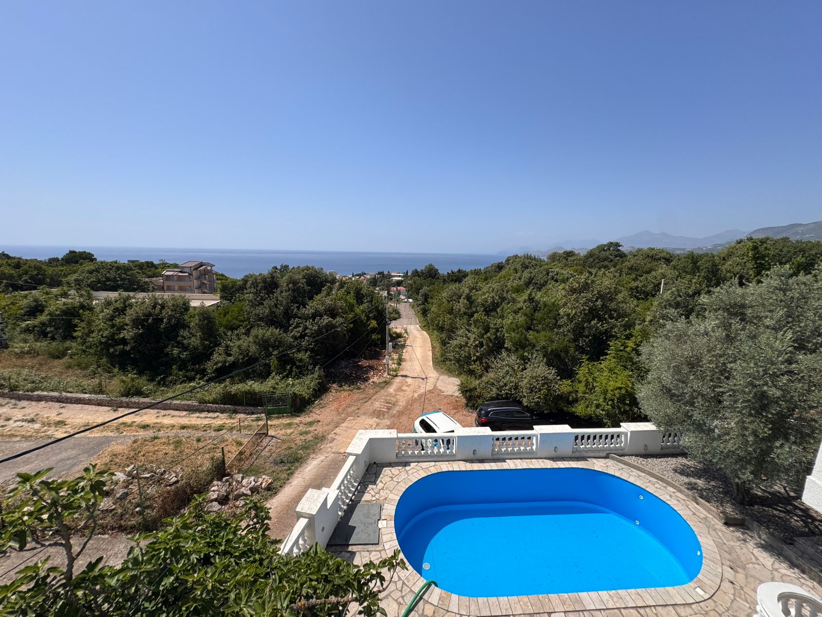 Stunning Ulcinj villa with blue pool, sea views, and lush greenery&mdash;prime Montenegro real estate from ekosphere doo on montenegro-listings.me.