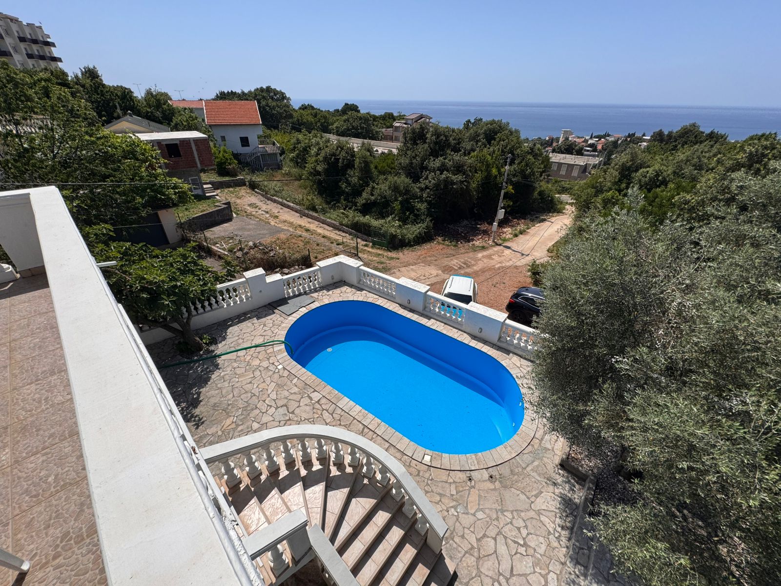 Prime Ulcinj real estate: private balcony, kidney-shaped pool, stone patio. Minutes to sea. Invest with montenegro-listings.me/Ekosphere doo.