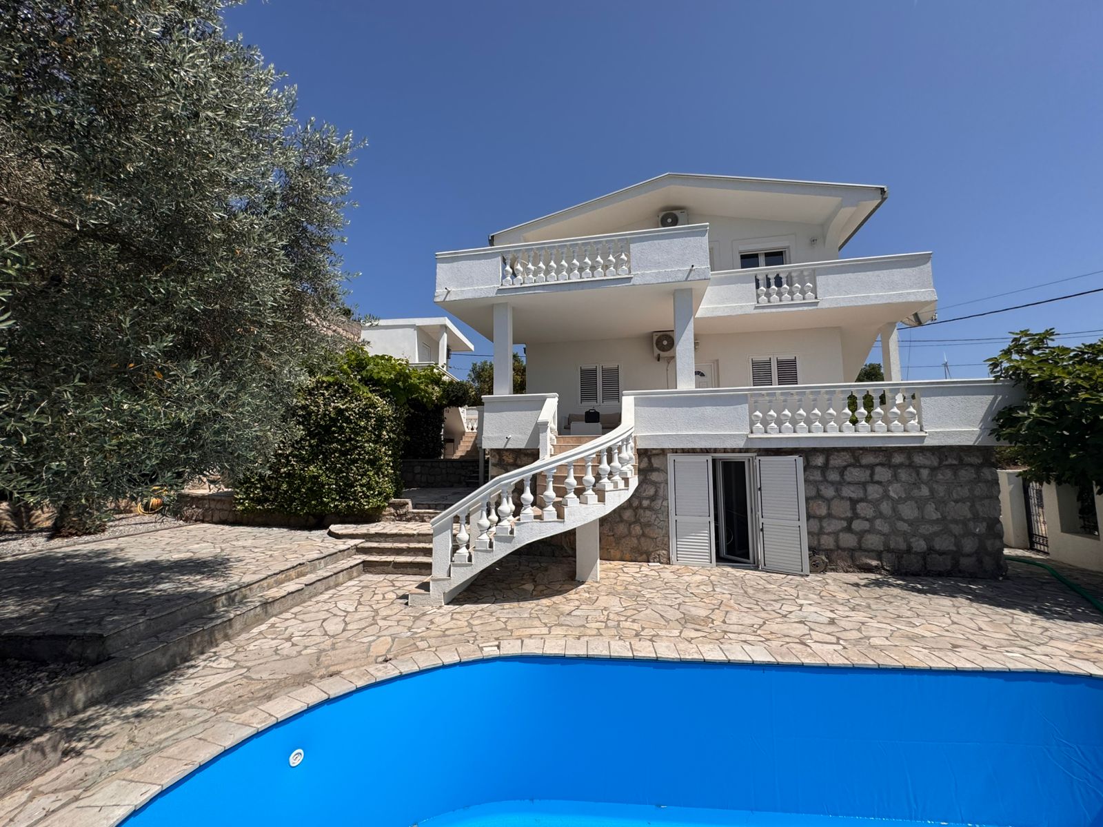 Elegant two-story villa with balconies and pool in Ulcinj, Montenegro—prime investment by Ekosphere on montenegro-listings.me.