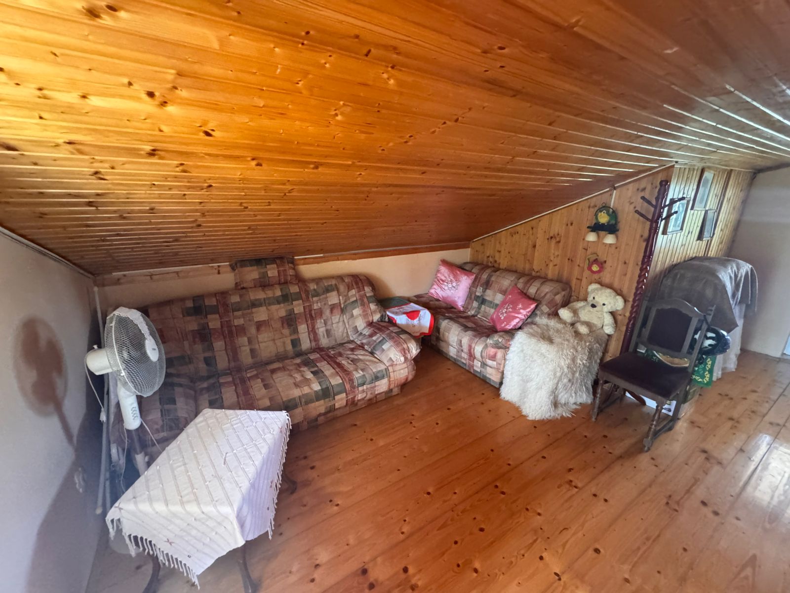 Charming attic room in Ulcinj, Montenegro with wood finishes, stylish sofas, ideal investment. Listed by montenegro-listings.me (Ekosphere doo).