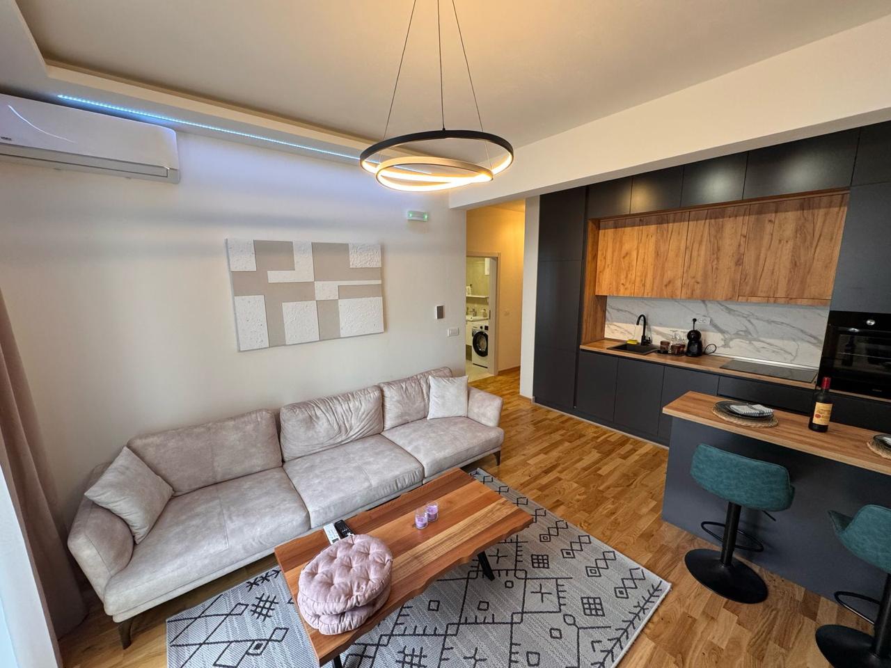 Stylish Ulcinj Montenegro apartment for sale: modern living/kitchen, beige sofa, ekosphere kitchen&mdash;exclusive at montenegro-listings.me.