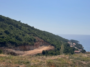 Prime cleared land on a green coastal hill in Ulcinj, Montenegro—ideal for investment; sea-view homes nearby. See montenegro-listings.me by ekosphere doo.