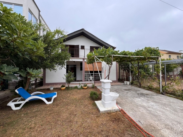 Stunning two-story Ulcinj house with covered balcony, pergola, garden—ideal Montenegro investment. Powered by ekosphere doo.