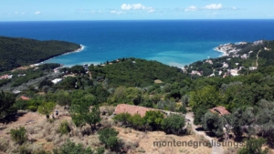 Discover prime Ulcinj, Montenegro real estate—forested hills, red-roof homes, sandy beaches & investment on montenegro-listings.me by ekosphere doo.