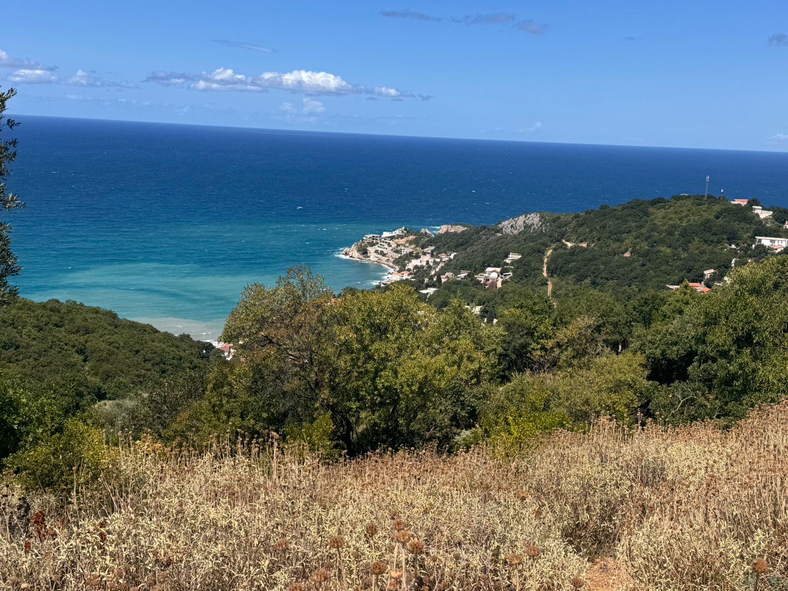 Discover prime real estate in Ulcinj, Montenegro—white homes on green hills with sea views, exclusively at montenegro-listings.me by ekosphere doo.