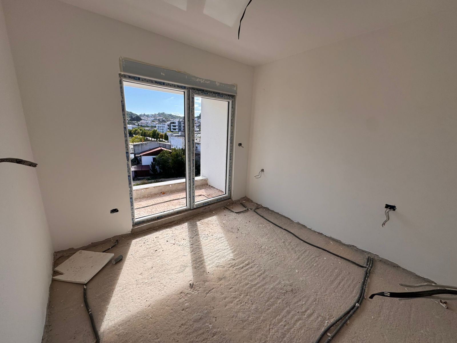 Unfinished room in Ulcinj, Montenegro with balcony, sliding glass doors, panoramic views&mdash;ideal investment via montenegro-listings.me (ekosphere doo).
