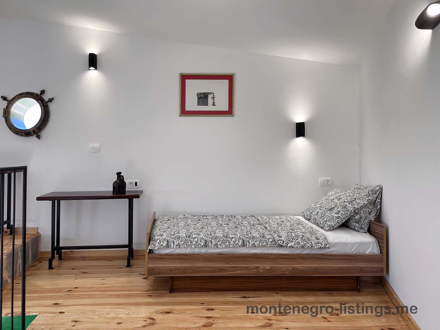 Chic Ulcinj, Montenegro bedroom with wood bed, stylish decor, warm floors&mdash;prime real estate on montenegro-listings.me by Ekosphere.