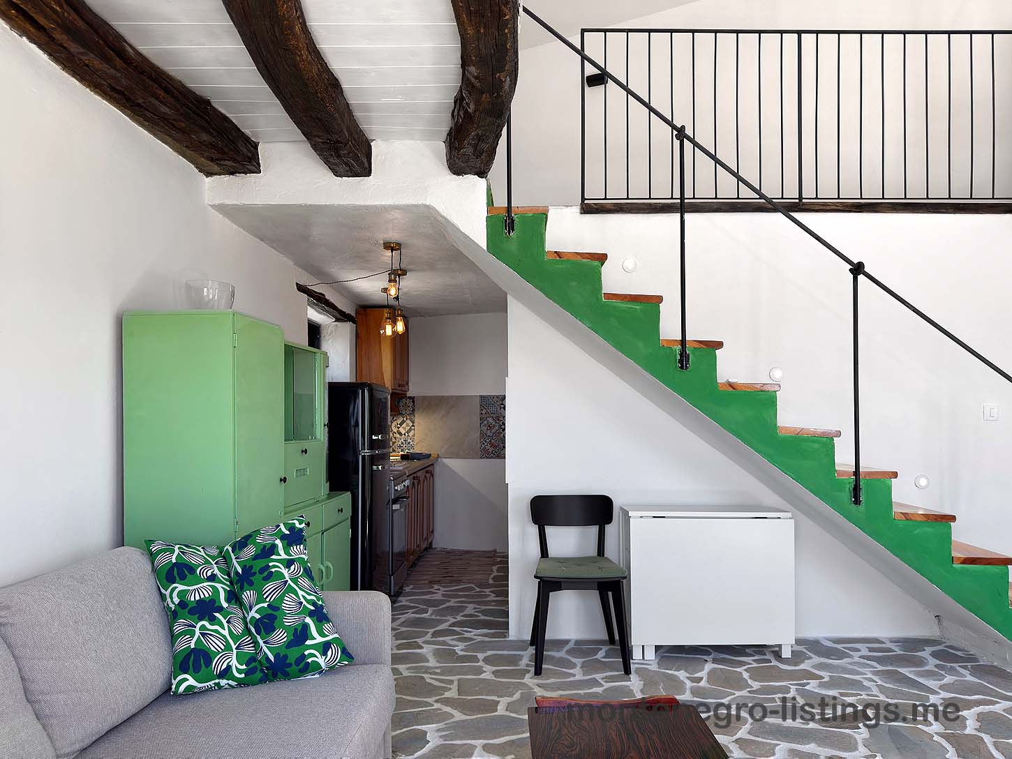 Stylish Ulcinj flat with green kitchen, exposed beams, and patterned tiles&mdash;ideal investment on montenegro-listings.me by ekosphere doo.