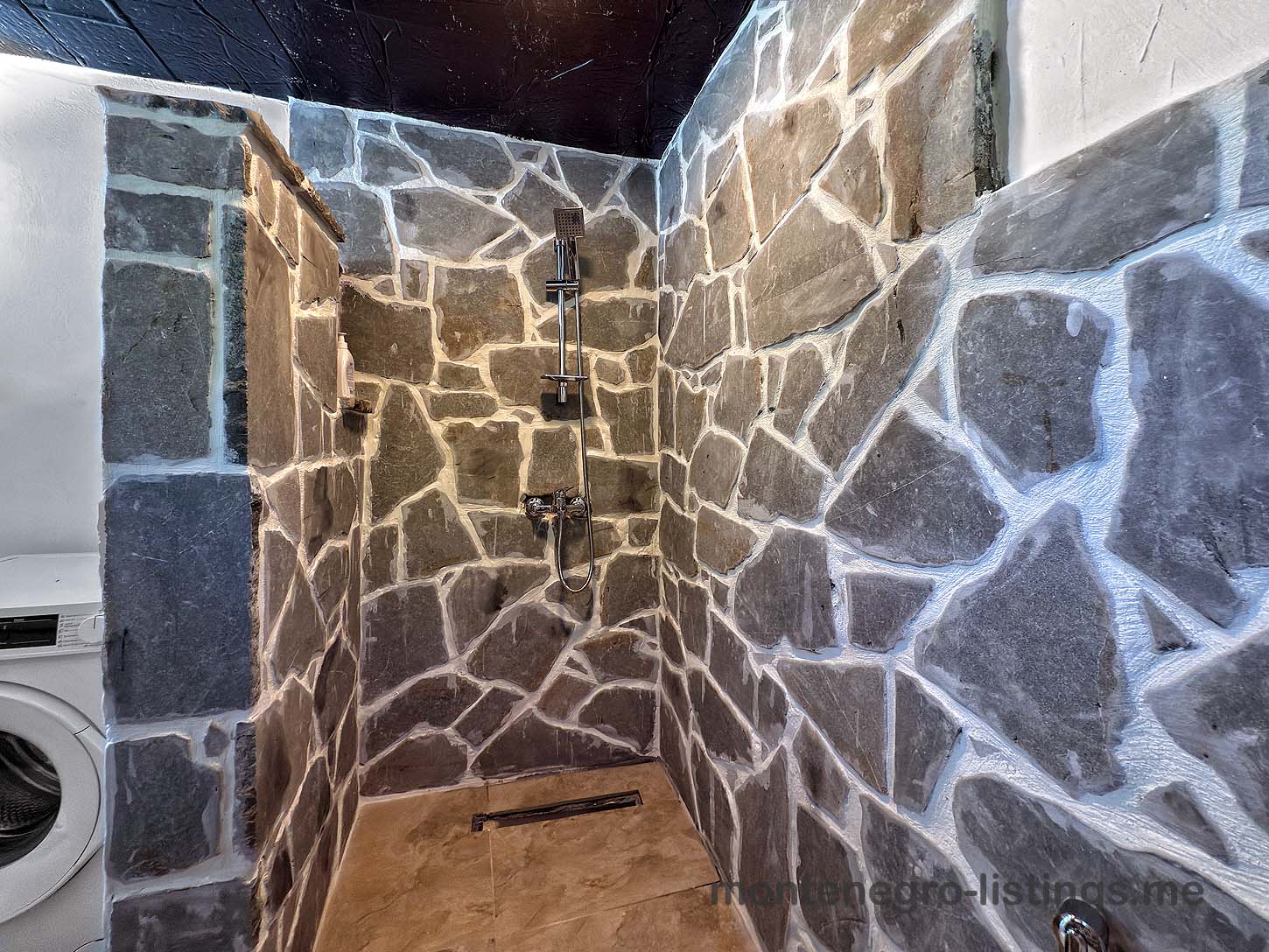 Luxurious Ulcinj shower: stylish stone tiles, rainfall shower, eco washing machine. Exclusive Ekosphere DOO on montenegro-listings.me.