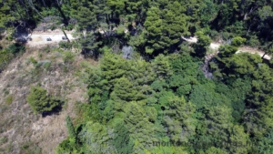 Aerial view of prime Ulcinj Montenegro real estate near lush forests and access roads—ideal investment. A project of ekosphere doo.