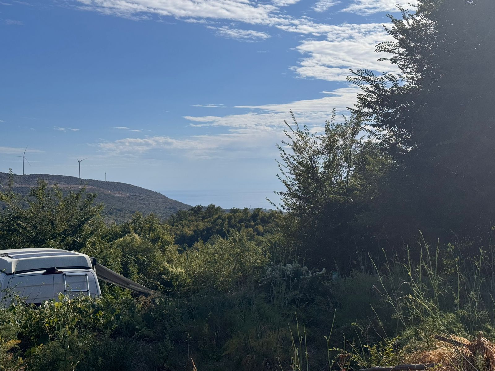 Prime Ulcinj Montenegro real estate site: lush greenery, hills, wind turbines, near properties by ekosphere doo at montenegro-listings.me.