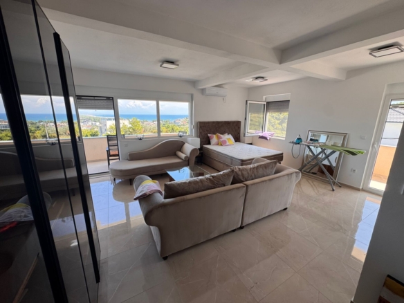 Listings for Rent in Ulcinj: Bright, modern room in Ulcinj, Montenegro with large windows, elegant furnishings—ideal investment. Discover more at montenegro-listings.me by ekosphere doo.