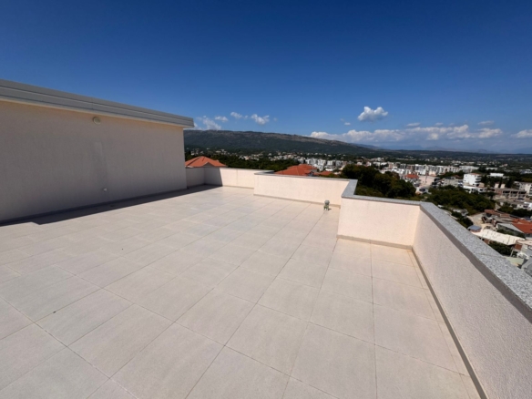 Expansive tiled rooftop terrace with panoramic Ulcinj views—ideal Montenegro real estate from Ekosphere doo at montenegro-listings.me.