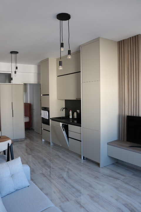Luxury modern kitchen in Ulcinj, Montenegro with marble floors, top appliances, designer lighting. Invest via montenegro-listings.me by ekosphere doo.