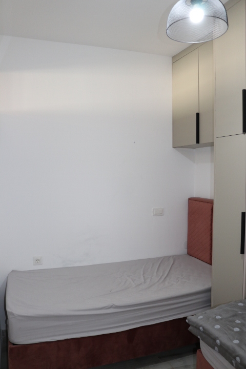 Modern, well-appointed bedroom in Ulcinj with built-in storage, ideal for investment; discover more on montenegro-listings.me by ekosphere doo.