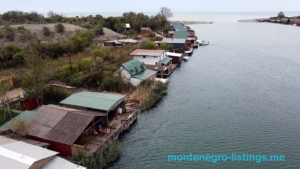 Waterfront homes with private docks on a scenic canal in Ulcinj. Investment gem on montenegro-listings.me by ekosphere doo.