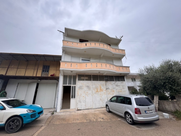 Stunning three-story peach & white building with large balconies in Ulcinj. Prime investment at montenegro-listings.me by ekosphere doo.