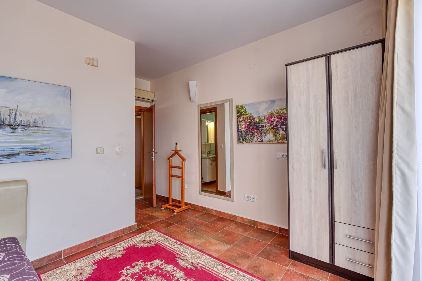 Elegant Ulcinj property: bright room with quality wardrobe, mirror, bath access, stylish tiles&mdash;exclusive on montenegro-listings.me by ekosphere doo.