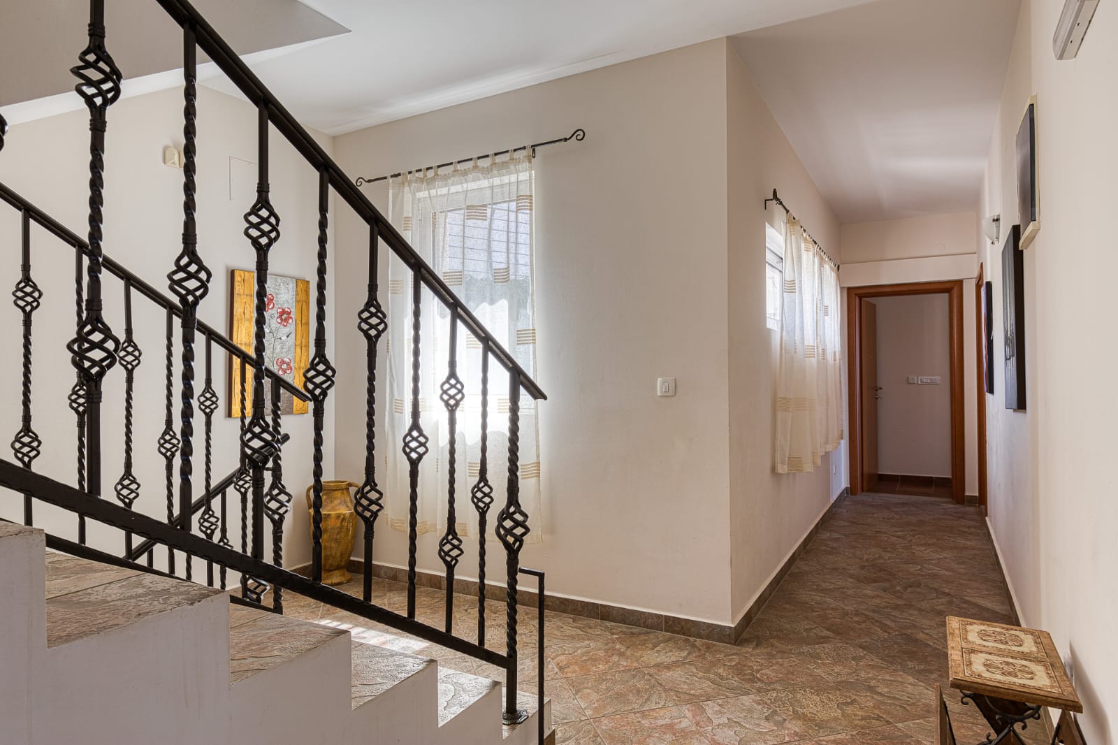Elegant hallway with tiled floors, decorative staircase, and modern finishes&mdash;prime Ulcinj investment by ekosphere doo at montenegro-listings.me.