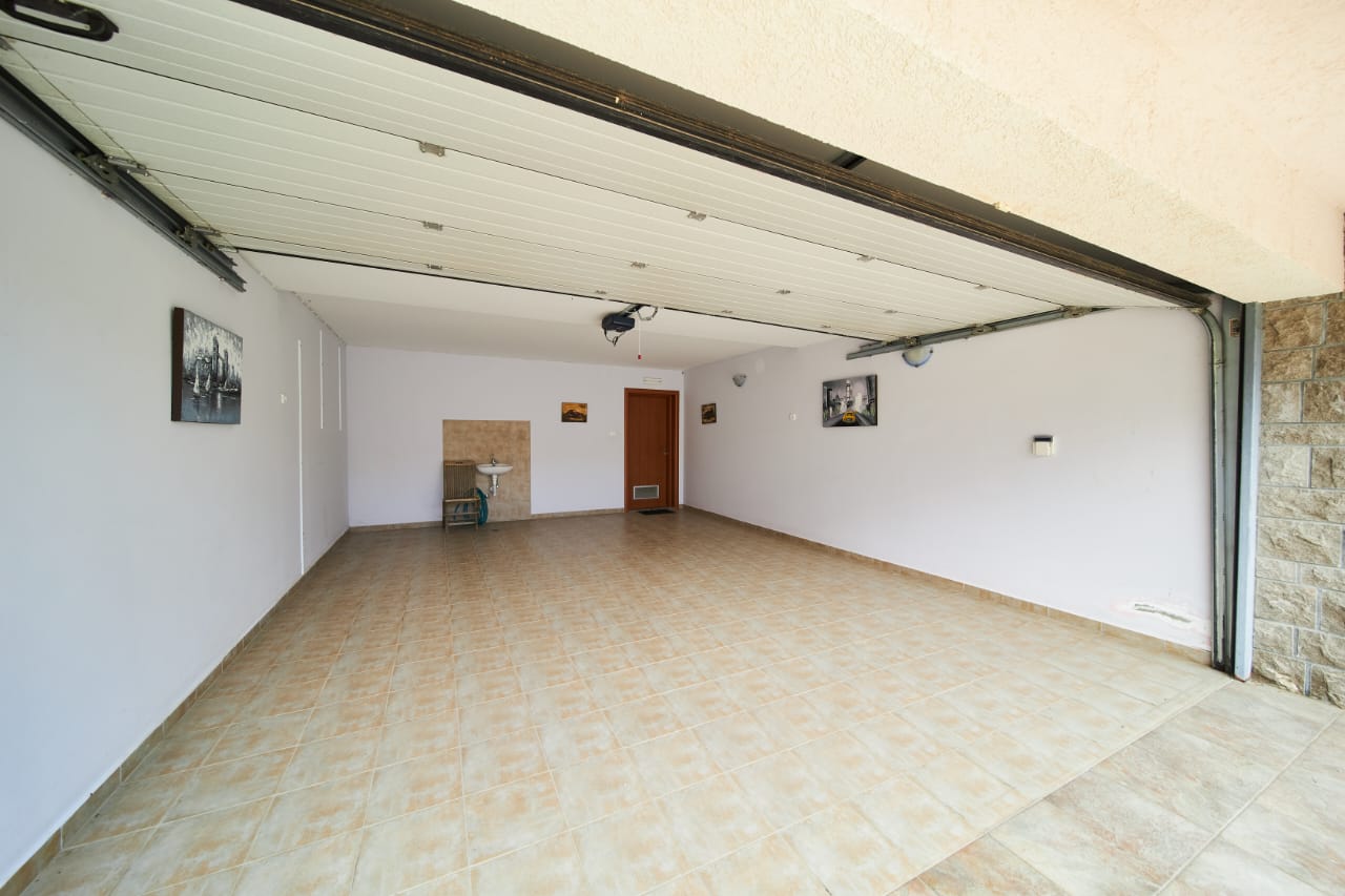 Spacious tiled garage in Ulcinj, Montenegro, ideal for secure parking or storage. Exclusive property at montenegro-listings.me.