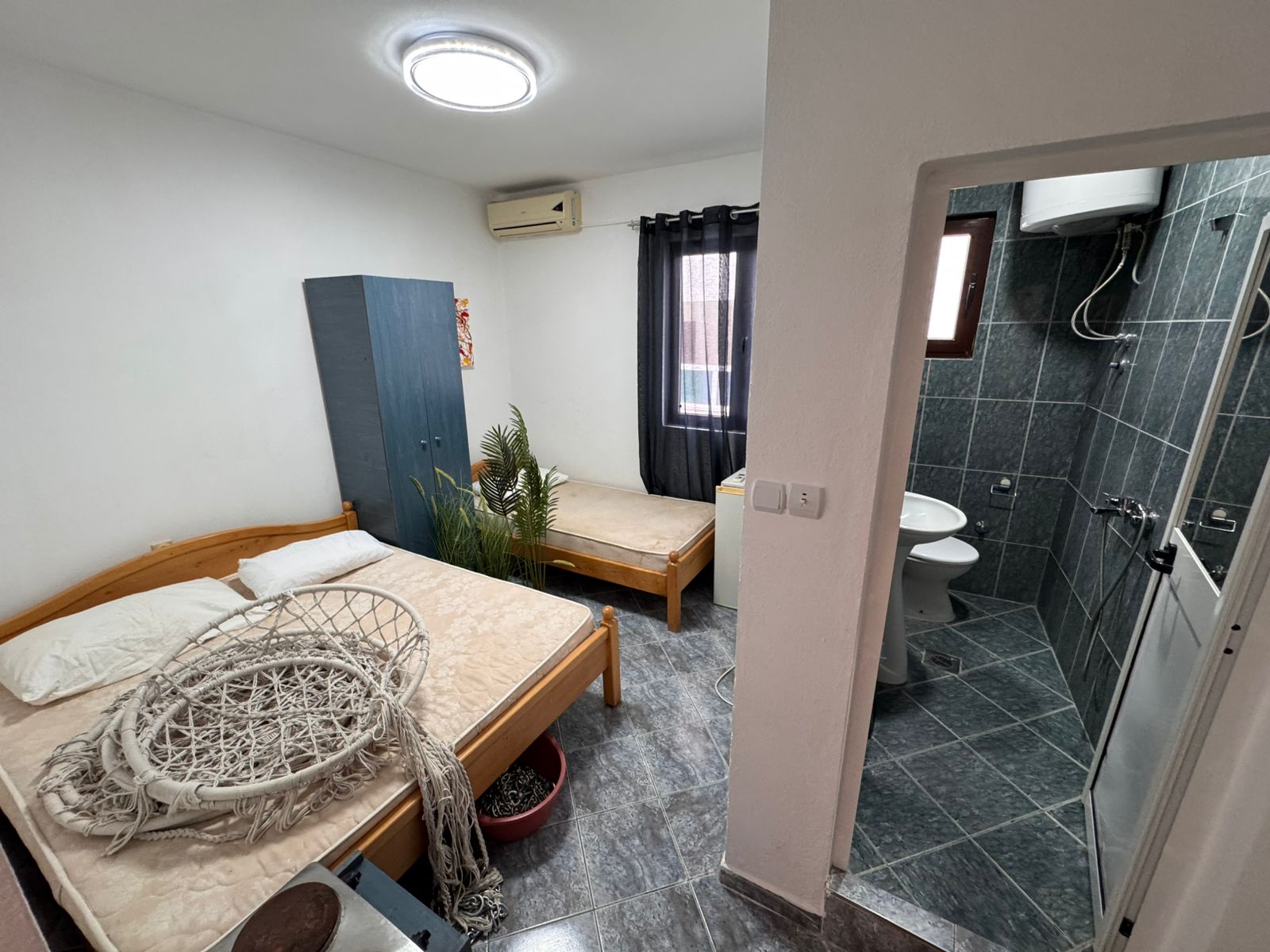 Charming Ulcinj bedroom: 2 beds, wardrobe, tiled floors, en suite bath. Great Montenegro investment via montenegro-listings.me by ekosphere doo.