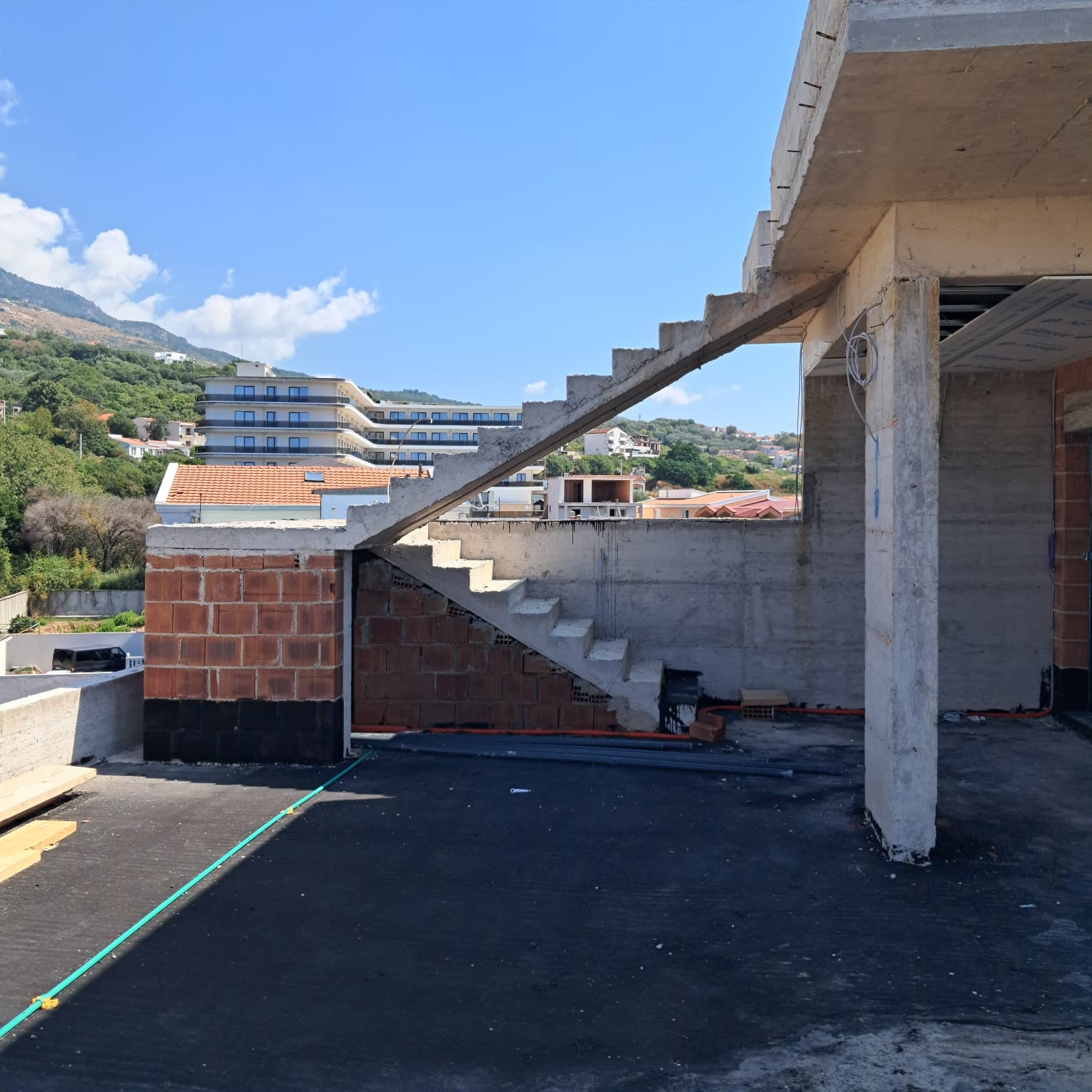 Prime Ulcinj investment: unfinished property with concrete stairs, exposed brick, scenic views. Listed by montenegro-listings.me/Ekosphere DOO.