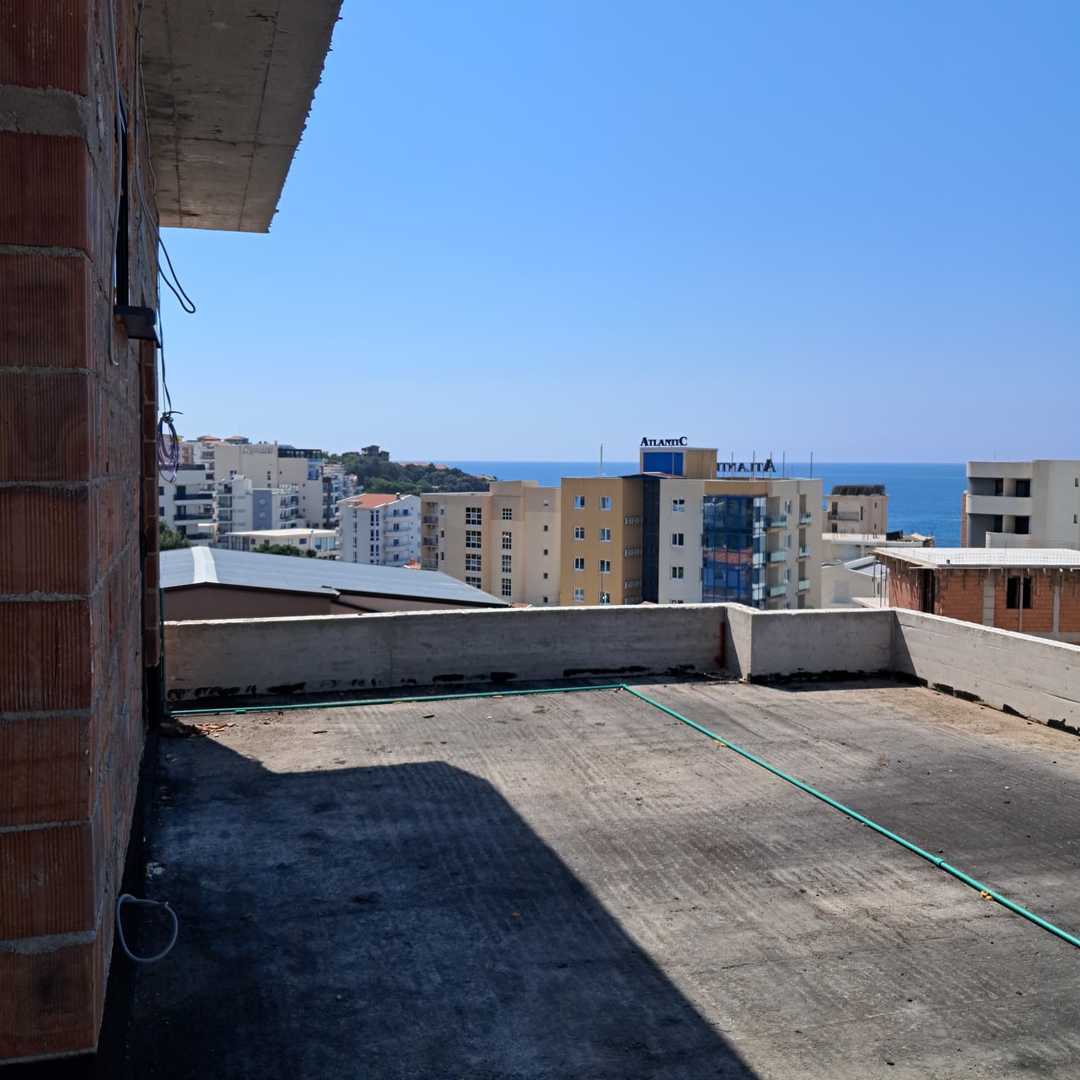Panoramic rooftop view in Ulcinj: investment-ready property with sea views, solid build, and excellent location. Eksphere DOO project.