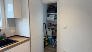 Modern Ulcinj kitchen with white cabinets, wooden countertops, and organized storage; exclusive at montenegro-listings.me by ekosphere doo.