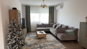 Spacious Ulcinj living room with L-shaped sofa, modern decor, AC, and stylish finishes—exclusive on montenegro-listings.me by Ekosphere Doo.